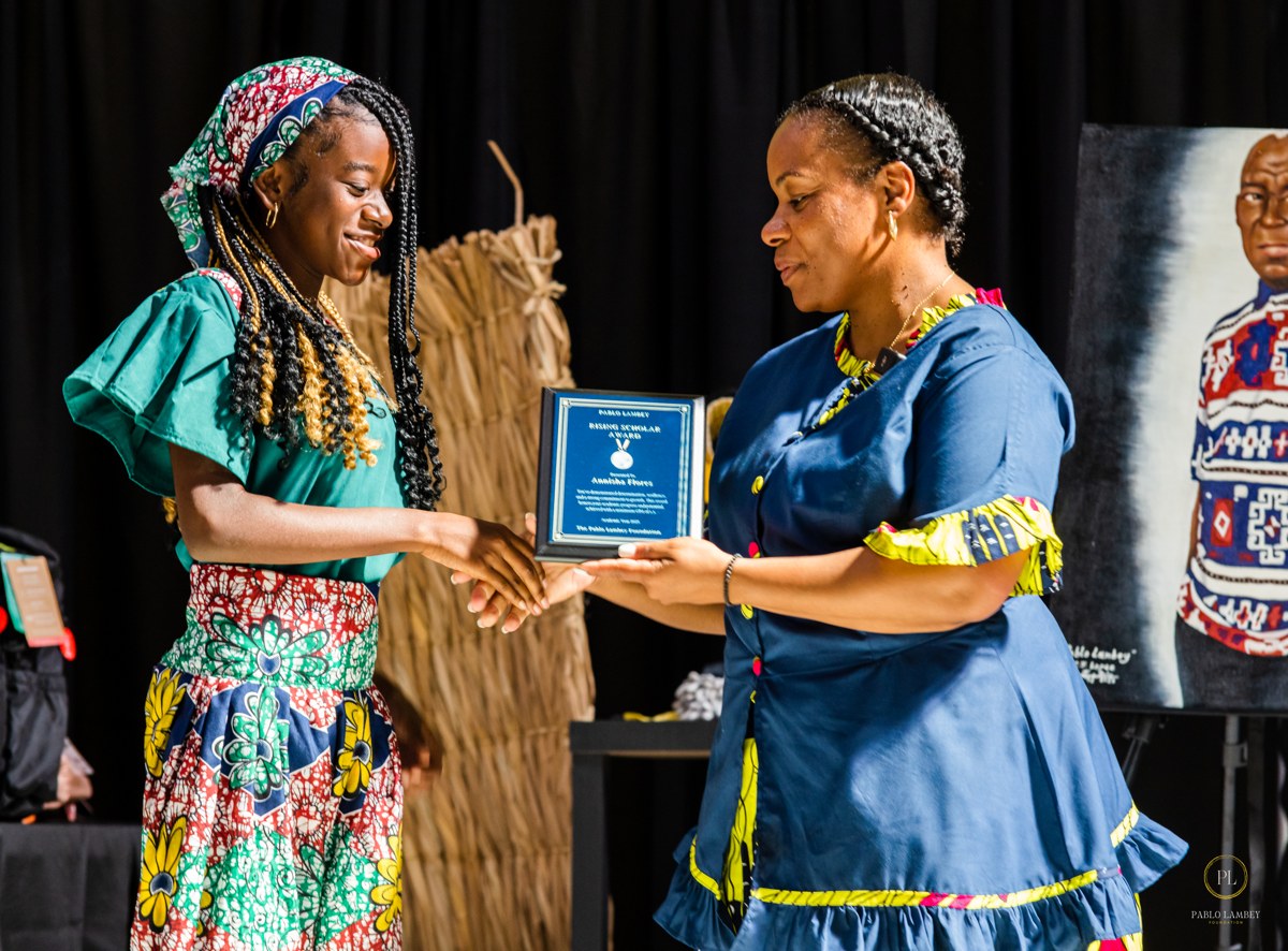 A student receiving a Pablo Lambey Foundation scholarship award